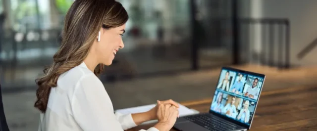 Woman with a laptop in a virtual meeting