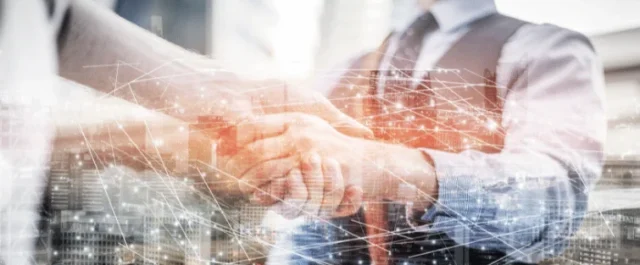 two persons shaking hands